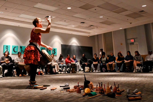 Kristen Arant drummer with students and instraments